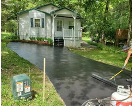 Newly sealed residential driveway looking from street to house