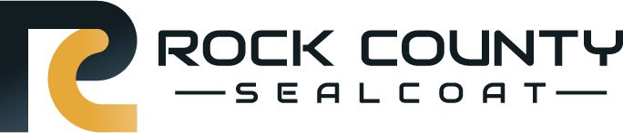 full black and yellow Rock County Sealcoat logo on transparent background